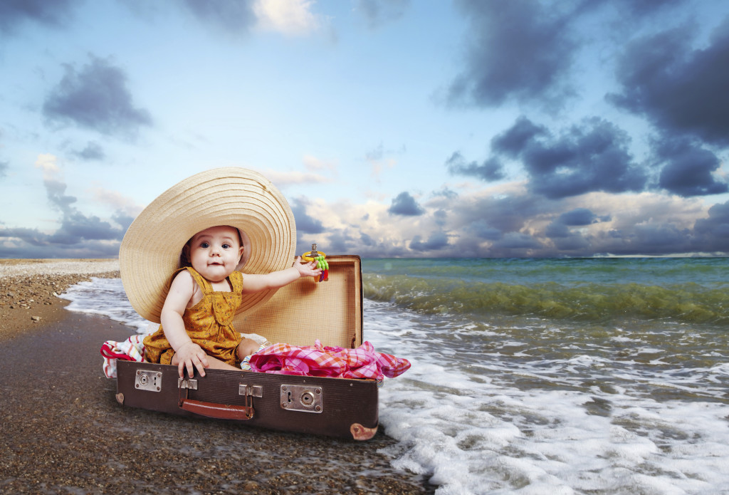 Little traveler in suitcase